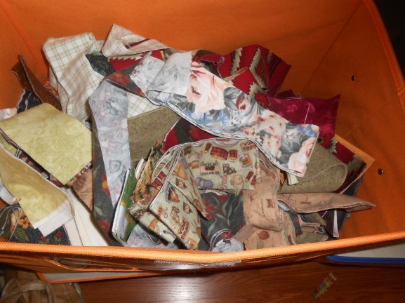 Box full of pre-cut 2 1/2 inch flannel strips ready for a log cabin quilt pattern!