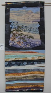 Niko's Secret Robe (2015). Pre-printed kimono panel with piecing by Tierney Davis Hogan. Quilted by T. Hogan.