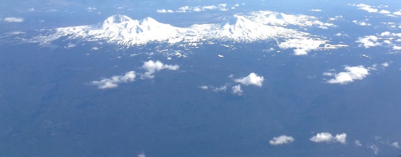 Three Sisters Mountains of the Cascade Mountain range as viewed during an airplane flight